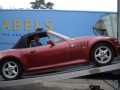 BMW Z3 unloading from shipping container with ramps