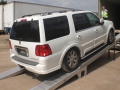 Lincoln Navigator on loading ramps